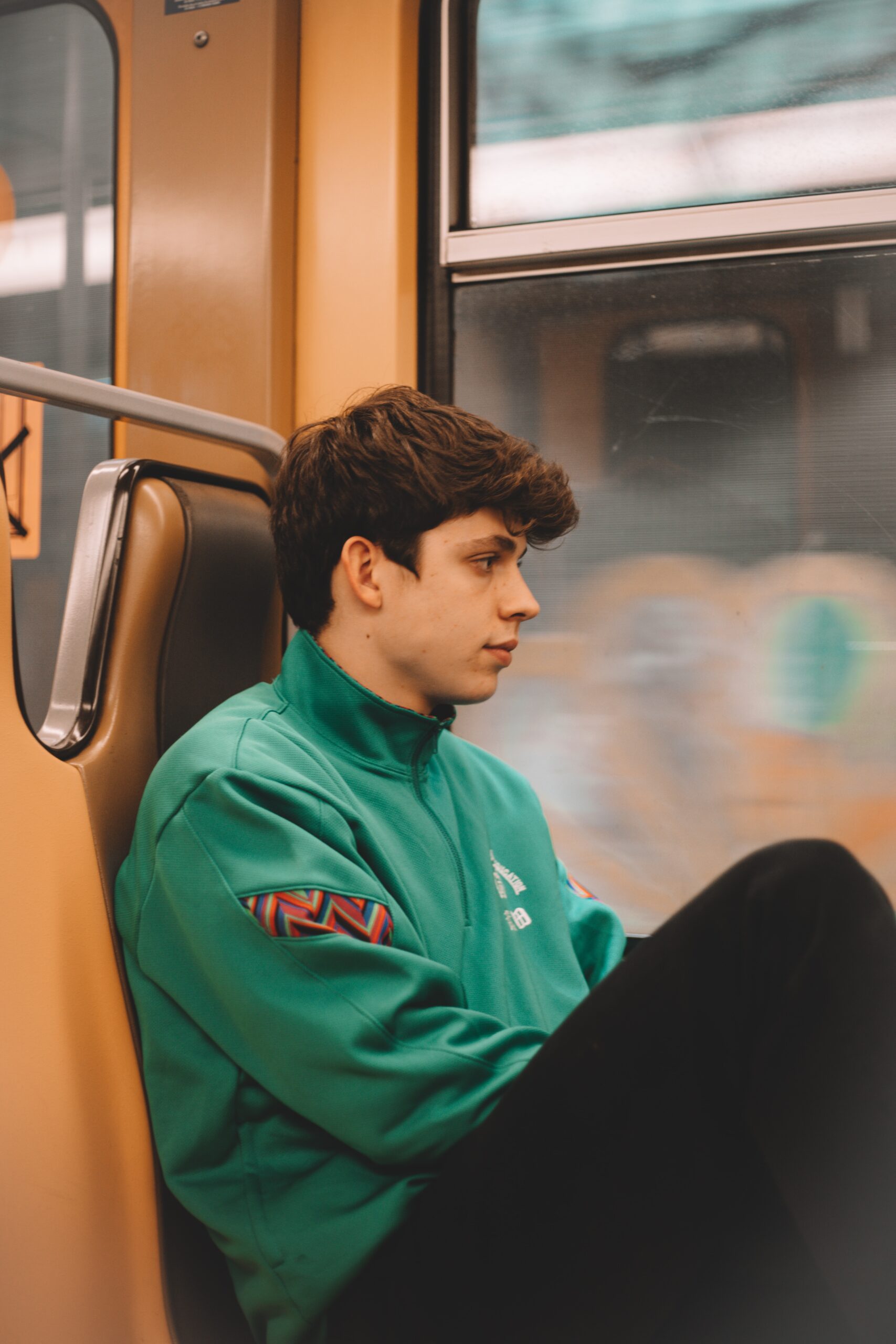 Contemplative student riding subway